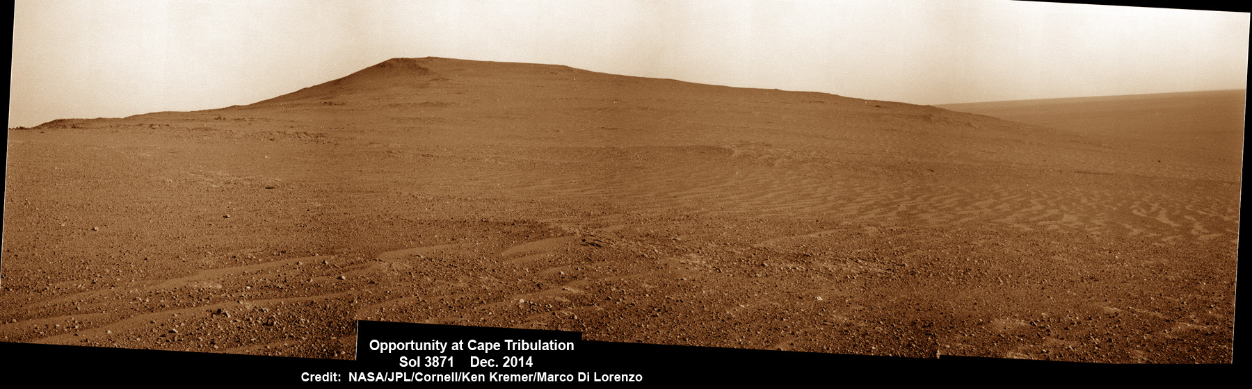 NASA’s Opportunity Mars rover scans to the summit of Cape Tribulation less than 100 meters distant in mid-December 2014 with hi res pancam camera.  Beyond lie caches of clay minerals. The scene shows impact breccias and thin soil cover with cobbles over bedrock.  This pancam camera photo mosaic was assembled from images taken on Sol 3871, Dec. 13, 2014 and colorized.  Credit: NASA/JPL/Cornell/ Ken Kremer - kenkremer.com/ Marco Di Lorenzo