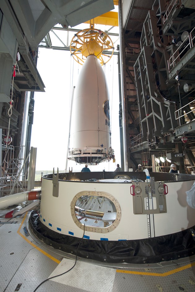 The MUOS-3 payload, encapsulated within its bulbous payload fairing, is readied for installation atop the Atlas V 551. This will be the first of 13 missions planned by United Launch Alliance (ULA) in 2015. Photo Credit: ULA