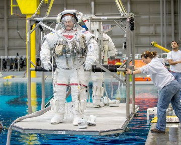 Expedition 44 crewmen Kjell Lindgren (foreground) and Kimiya Yui prepare for an underwater EVA simulation. Photo Credit: NASA