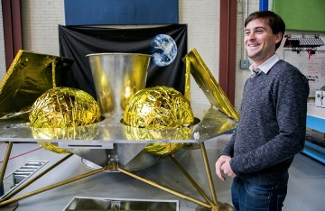 John Thornton, CEO of team Astrobotic, with their Griffin Moon lander after their big wins. (Photo credit: Google Lunar XPRIZE)