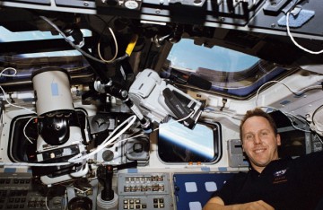 Tom Jones is pictured amid camera equipment on Endeavour's flight deck during the busy STS-68 mission. Photo Credit: NASA