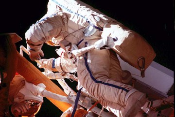 Linenger (with blue stripes on the legs of his Orlan-M suit) and Tsibliyev participate in the first joint U.S.-Russian EVA on 29 April 1997. Photo Credit: NASA