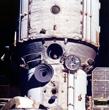 Valeri Polyakov, pictured at Mir's windows during the STS-63 shuttle rendezvous mission in February 1995, is the incumbent record-holder for the longest single spaceflight. Photo Credit: NASA, via Joachim Becker/SpaceFacts.de