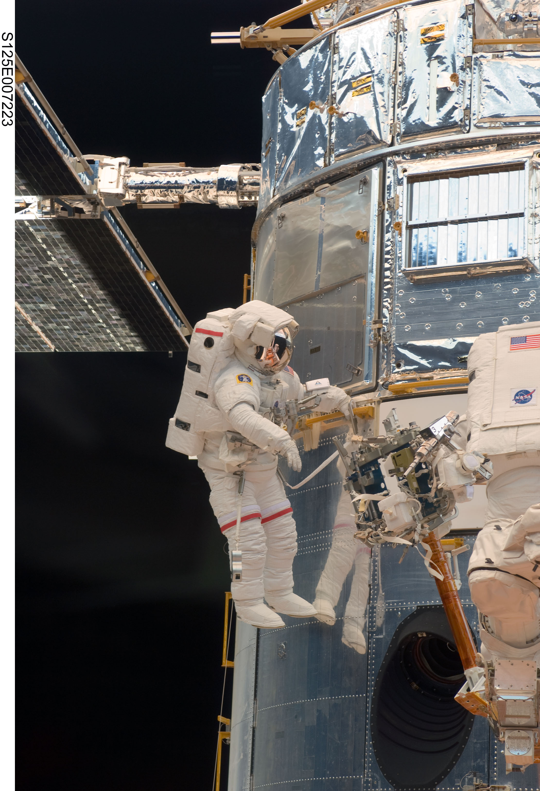 Astronaut John Grunsfeld performs work on the Hubble Space Telescope on the first of five STS-125 spacewalks.  Credit: NASA