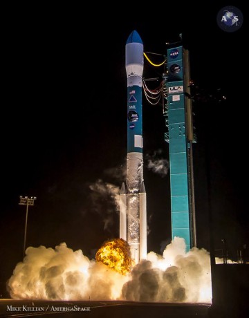 With the flare of its RS-27A first-stage engine and trio of Solid Rocket Motors (SRMs), the Delta II takes flight at 6:22 a.m. PST Saturday, 31 January. Photo Credit: Mike Killian/AmericaSpace