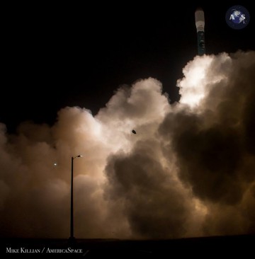 Ascending from the midst of billowing clouds of smoke, the Delta II was quickly lost from view in the foggy murk which enveloped Vandenberg Air Force Base in the pre-dawn of Saturday morning. Photo Credit: Mike Killian/AmericaSpace