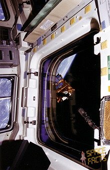 The OAST-Flyer payload, pictured in the grasp of the RMS. Photo Credit: NASA, via Joachim Becker/SpaceFacts.de