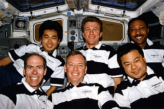 The STS-72 crew celebrate their success. Front row (from left) are Barry, Duffy and Chiao, with Wakata, Jett and Scott behind. Photo Credit: NASA, via Joachim Becker/SpaceFacts.de