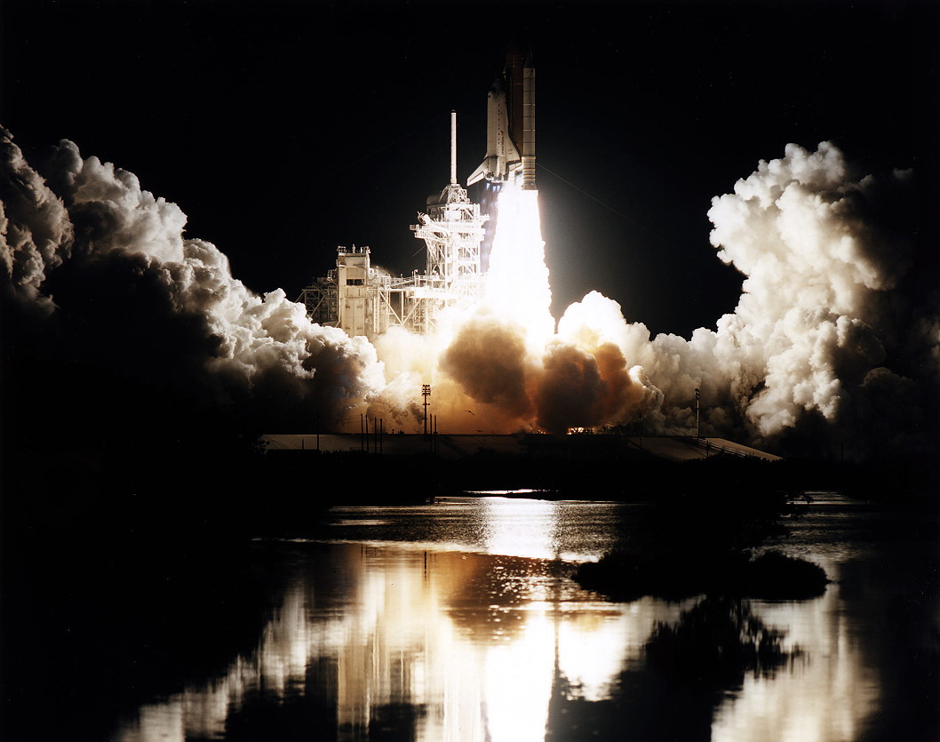 Atlantis roars into the night on 12 January 1997, kicking off the shuttle program's fifth docking mission to Mir. Photo Credit: NASA, via Joachim Becker/SpaceFacts.de