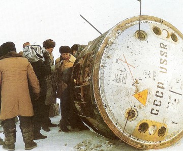 Carrying Yuri Romanenko and his crewmates back to Earth, the Soyuz TM-3 descent module lies on its side after touchdown on 29 December 1987. Photo Credit: Joachim Becker/SpaceFacts.de