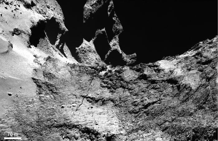 A crack in the comet.  This OSIRIS narrow-angle camera image shows part of a large fracture running across Comet 67P/Churyumov–Gerasimenko’s neck into the Anuket region, Credits: ESA/Rosetta/MPS for OSIRIS Team MPS/UPD/LAM/IAA/SSO/INTA/UPM/DASP/IDA