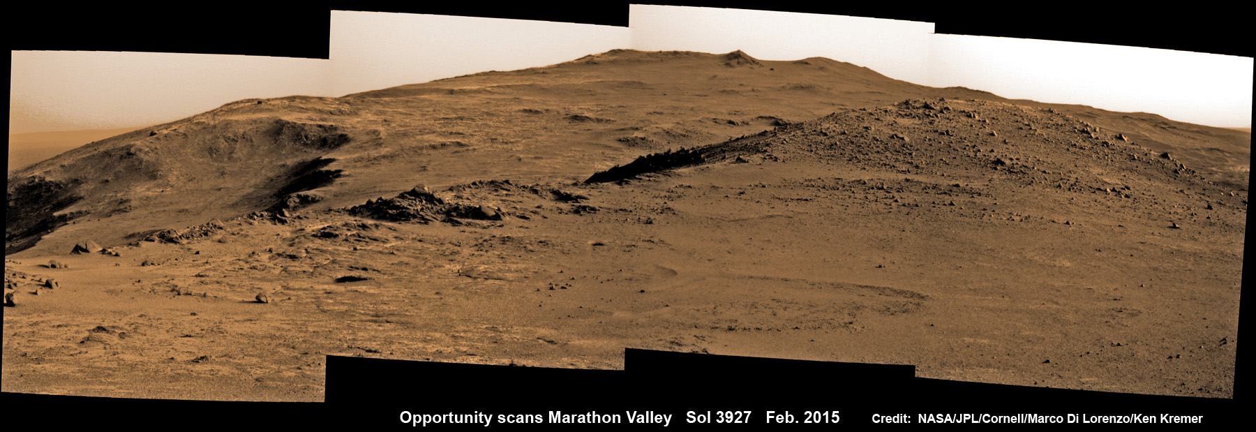 NASA Opportunity Rover look ahead to Marathon Valley and Martian cliffs on Endeavour crater holding deposits of water altered clay minerals science treasure on Feb. 10, 2015.  Rover operates well after 11 Years trekking Mars.   This pancam camera photo mosaic was assembled from images taken on Sol 3927 (Feb. 10, 2015) and colorized.  Credit: NASA/JPL/Cornell/ Marco Di Lorenzo/Ken Kremer/kenkremer.com