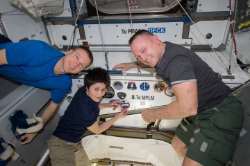 The key players in Wednesday's EVA-30 were Barry "Butch" Wilmore (right) and Terry Virts, with Samantha Cristoforetti (center) as the Intravehicular (IV) crew member and operator of the 57.7-foot-long (17.6-meter) Canadarm2. Photo Credit: NASA