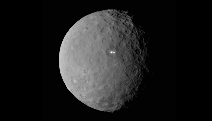 2 Brightest spots on Ceres.  This image was taken by NASA's Dawn spacecraft of dwarf planet Ceres on Feb. 19 from a distance of nearly 29,000 miles (46,000 kilometers). It shows that the brightest spot on Ceres has a dimmer companion, which apparently lies in the same basin.   Credit:  NASA/JPL-Caltech/UCLA/MPS/DLR/IDA
