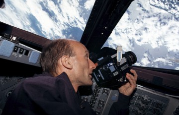 Gerhard Thiele observes a point on Earth during STS-99. Photo Credit: NASA