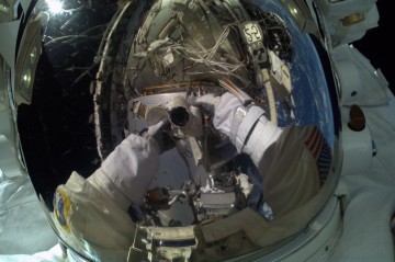 Reflected in his own visor, Terry Virts takes a stunning "selfie" during his first career EVA. Photo Credit: Terry Virts/NASA/Twitter