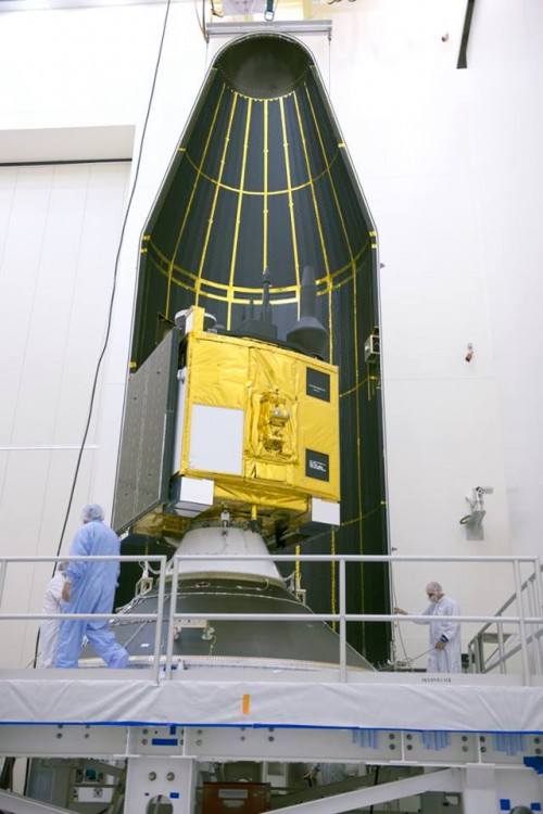 The GPS IIF-9 being encapsulated in preparation for its scheduled March 25 launch. This is the first of three GPS IIF satellites scheduled for launch in 2015. Photo Credit: USAF
