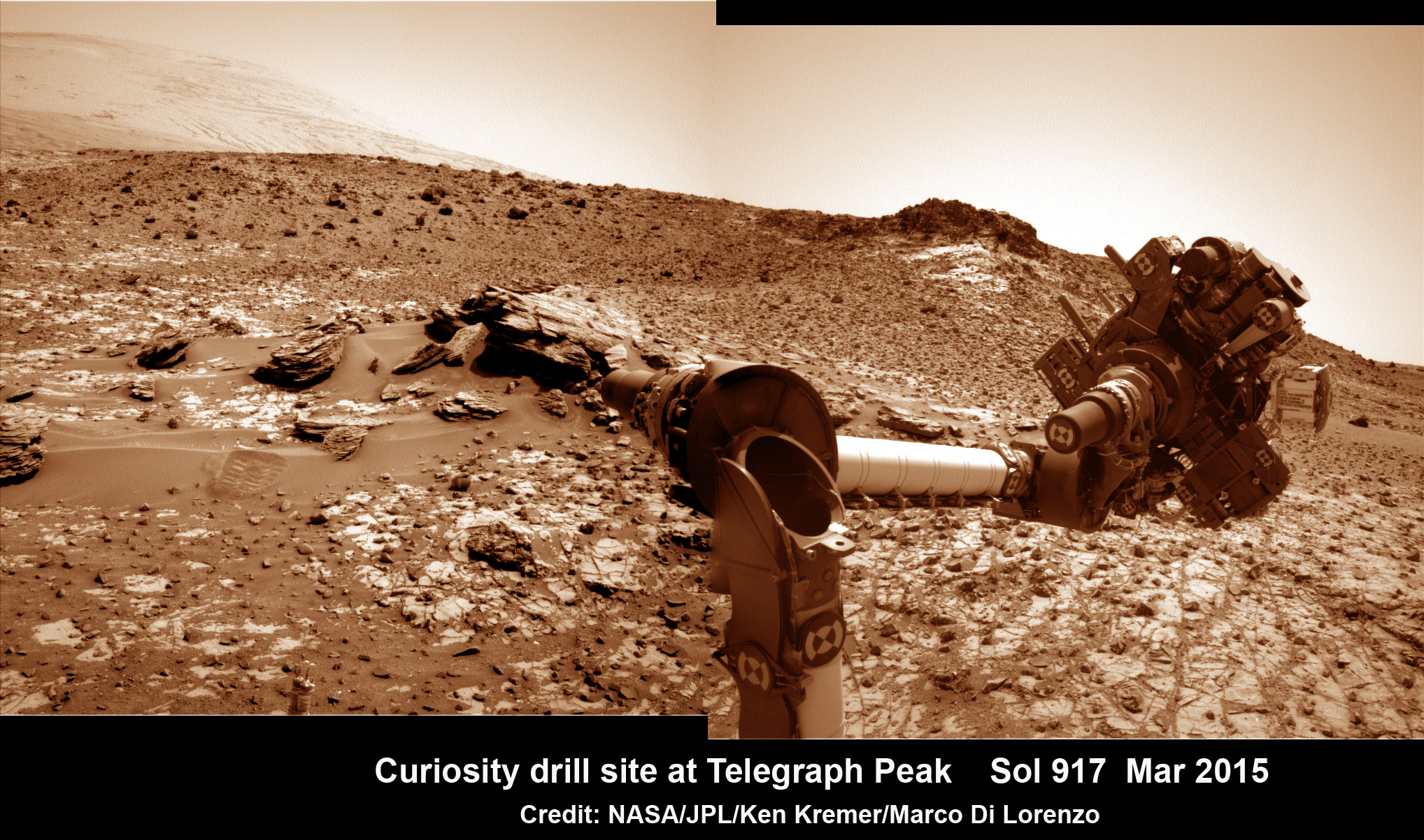 This March 6, 2015 (Sol 917), mosaic of images from the Navcam camera on NASA's Curiosity Mars rover shows the position in which the rover held its arm for several days after a transient short circuit triggered onboard fault-protection programming to halt arm activities on Feb. 27, 2015, Sol 911. The rover team chose to hold the arm in the same position for several days of tests to diagnose the underlying cause of the Sol 911 event. Navcam camera raw images stitched and colorized. Credit: NASA/JPL-Caltech/Ken Kremer/kenkremer.com/Marco Di Lorenzo