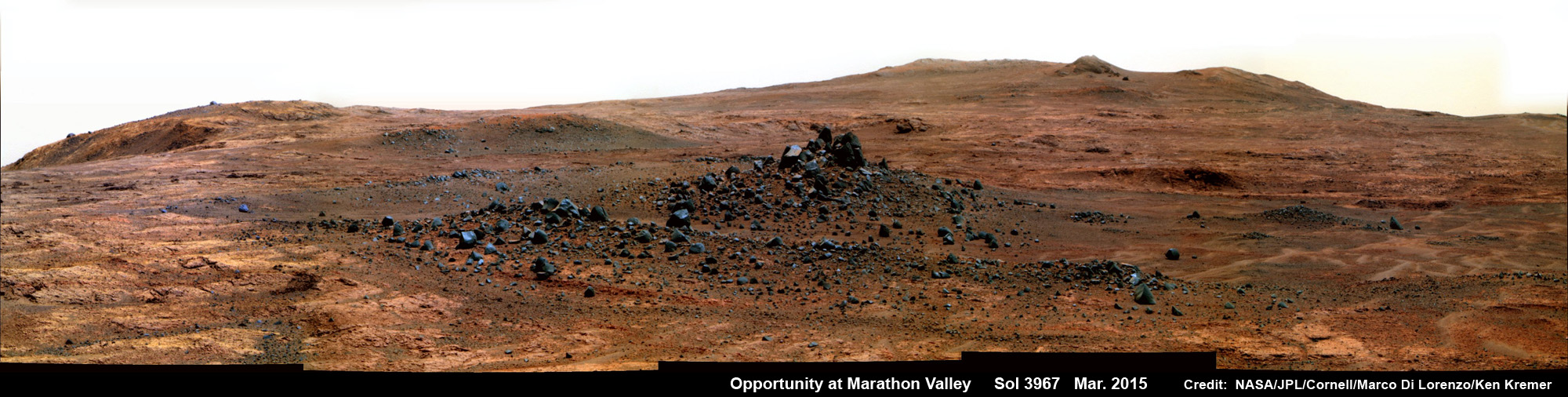 Opportunity’s spectacular mountaintop view by Spirit of Saint Louis Crater at Marathon Valley on March 23, the day before the NASA rover exceeded the distance of a marathon on the surface of Mars on March 24, 2015, Sol 3968. This pancam camera photo mosaic was assembled from images taken on Sol 3967 (March 23, 2015) and colorized.  Credit: NASA/JPL/Cornell/Marco Di Lorenzo/Ken Kremer/kenkremer.com