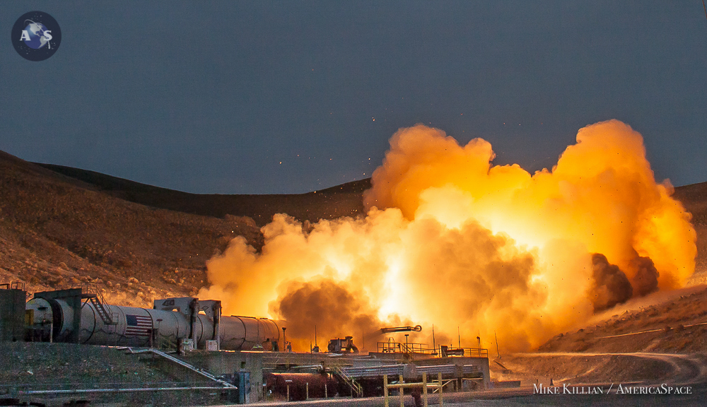 An Orbital ATK five-segment solid rocket booster igniting on the test stand in Promontory, Utah on March 11, 2015, unleashing 3.6 million pounds of thrust within a second for the Qualification Motor-1 (QM-1) test fire for NASA's Space Launch System (SLS). Photo Credit: Mike Killian / AmericaSpace