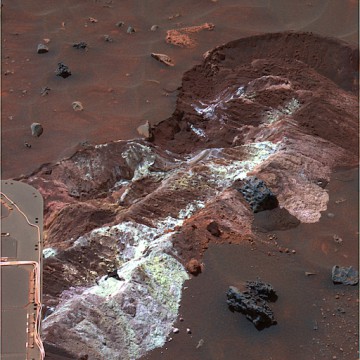 Salty deposits found by Spirit as its broken wheel dragged in the sand, which also point to past hydrothermal activity. Photo Credit: NASA/JPL-Caltech