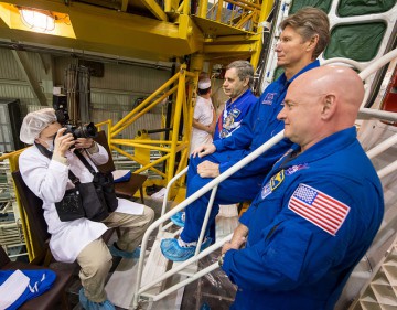 The crew (from left) Kornienko, Padalka and Kelly are photographed on the steps leading to their Soyuz TMA-16M spacecraft. Photo Credit: NASA