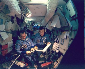 Gennadi Strekalov (left) and Vladimir Dezhurov are pictured at Mir's main command post in the base block. Photo Credit: NASA