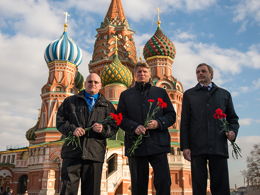 NASA Astronaut Scott Kelly, left, and cosmonauts Gennady Padalka and Mikhail Kornienko of Roscosmos are in front of St. Basil’s Cathedral in Moscow as part of traditional pre-launch ceremonies, Friday, March 6, 2015. Photo and Caption Credit: NASA / Bill Ingalls