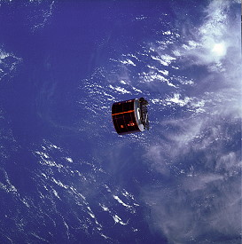 The Syncom 4-3 satellite drifts away from Discovery. The failure of its omni-directional antenna to deploy and of its solid-fueled perigee kick motor to ignite led to an impromptu rendezvous and repair attempt. Photo Credit: NASA