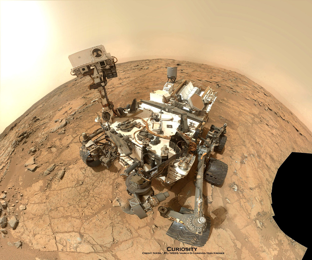 Curiosity Rover snapped this self portrait mosaic with the MAHLI camera while sitting on flat sedimentary rocks at the “John Klein” outcrop where the robot conducted historic first sample drilling inside the Yellowknife Bay basin, on Feb. 8 (Sol 182) at lower left in front of rover. The photo mosaic was stitched from raw images snapped on Sol 177, or Feb 3, 2013, by the robotic arm camera - accounting for foreground camera distortion. Credit: NASA/JPL-Caltech/MSSS/Marco Di Lorenzo/KenKremer/kenkremer.com