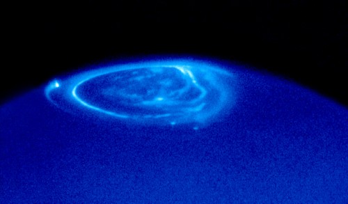 An ultraviolet image of Jupiter was taken with the Hubble Space Telescope, showing the planet's auroral lights (the bright emissions above the dark blue background). Image Credit: NASA, ESA & John T. Clarke (Univ. of Michigan)