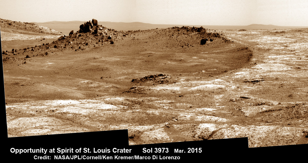 Opportunity arrives at Spirit of Saint Louis crater and peers into Marathon Valley and Endeavour crater from current location on Mars as of April 3, 2015 in this photo mosaic.  The crater is the gateway to Marathon Valley and exposures of water altered clay minerals.  This pancam camera photo mosaic was assembled from images taken on Sol 3973 (March 29, 2015) and colorized.  Credit: NASA/JPL/Cornell/ Ken Kremer/kenkremer.com/Marco Di Lorenzo