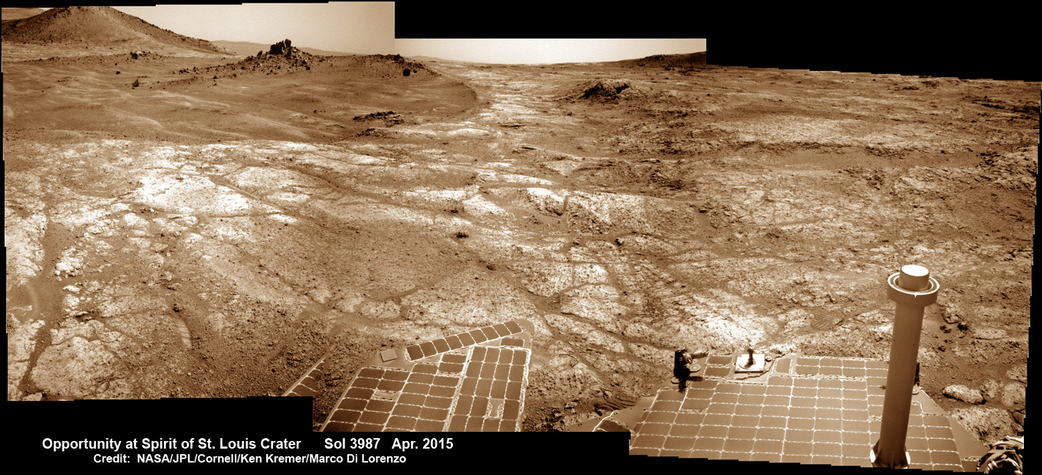 Opportunity at Spirit of Saint Louis crater scanning into Marathon Valley and Endeavour crater from current location on Mars in April 2015 in this photo mosaic.  The crater, featuring an odd mound of rocks, is the gateway to Marathon Valley and exposures of water altered clay minerals.  This pancam camera photo mosaic was assembled from images taken on Sol 3987 (April 12, 2015) and colorized.  Credit: NASA/JPL/Cornell/ Ken Kremer/kenkremer.com/Marco Di Lorenzo