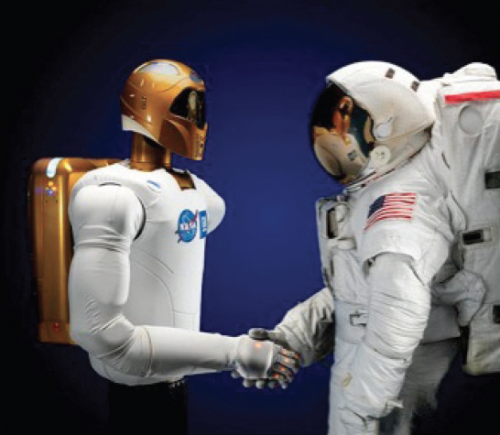 Robonaut 2, now onboard the International Space Station, shakes hands with an astronaut.