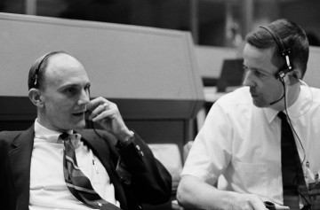 Capcom Joe Kerwin (right) and the mission's original Command Module Pilot (CMP), Ken Mattingly, discuss procedures in Mission Control, as Apollo 13 heads back to Earth. Photo Credit: NASA