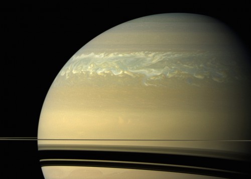 A giant storm in Saturn's northern hemisphere, which now extends around the planet, as seen by the Cassini spacecraft. Photo Credit: NASA/JPL-Caltech