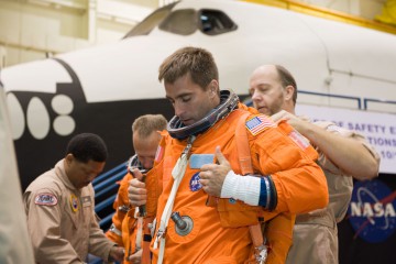 Chris Cassidy dons a training version of his shuttle launch and entry suit during preparations for STS-127. Photo Credit: NASA