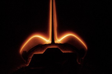 The eerie "atmospheric glow" phenomenon envelopes Columbia's aft compartment on STS-62 in March 1994, throwing the unusual shape of the Extended Duration Orbiter (EDO) pallet into stark contrast. Photo Credit: NASA