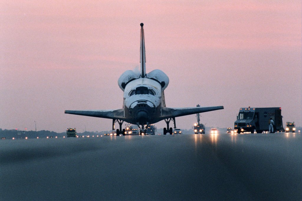 Columbia is approached by servicing vehicles on the runway on 7 December 1996, after concluding STS-80, the shuttle program's longest Extended Duration Orbiter (EDO) mission. Photo Credit: NASA