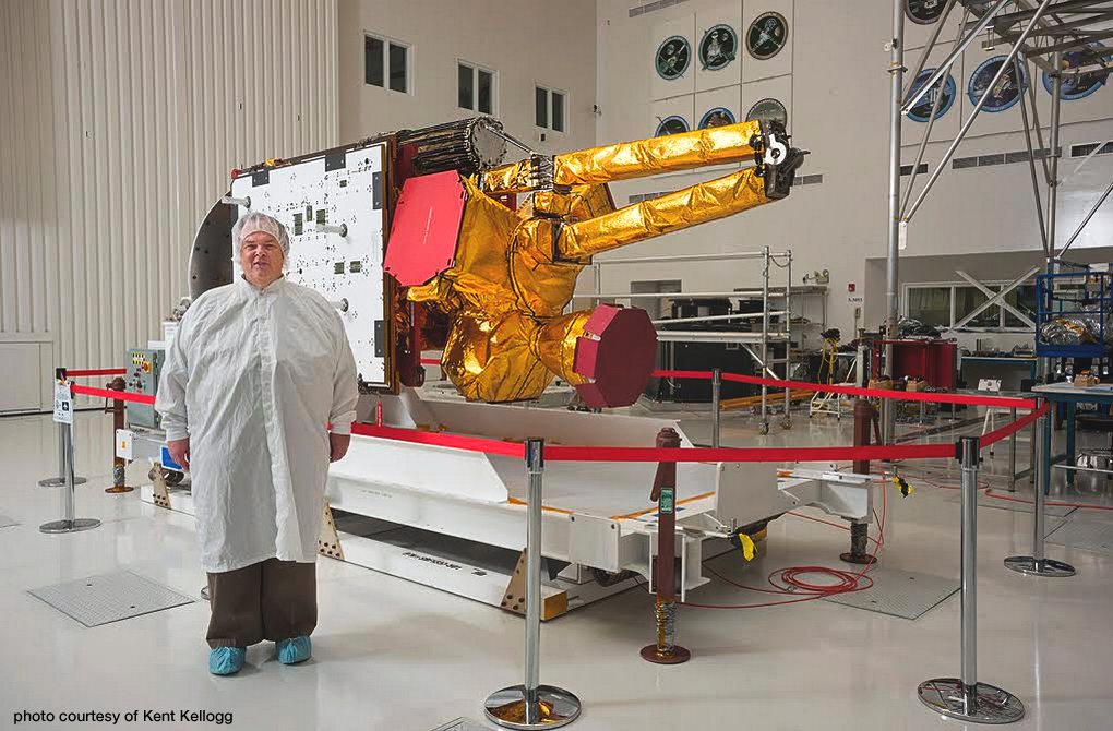 NASA/JPL’s SMAP Project Manager Kent Kellogg with the SMAP spacecraft, now in orbit above the Earth. Photo Courtesy: Kent Kellogg