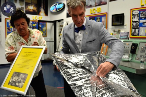 Bill Nye displays an example of what LightSail will look like once deployed in space. The fabric is made out of a light mylar material. Photo Credit: Talia Landman / AmericaSpace