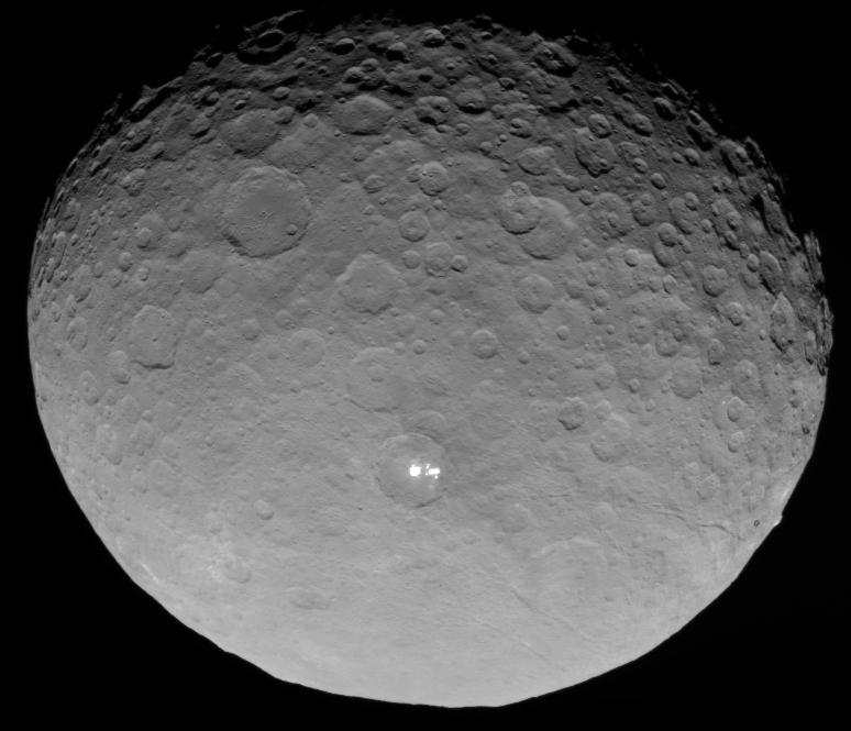 This image of Ceres was taken by NASA's Dawn spacecraft on May 4, 2015, from a distance of 8,400 miles (13,600 kilometers), in its RC3 mapping orbit. The brightest spots within a crater in the northern hemisphere are revealed to be composed of many smaller spots. The image resolution is 0.8 mile (1.3 kilometers) per pixel. Credit: NASA/JPL-Caltech/UCLA/MPS/DLR/IDA