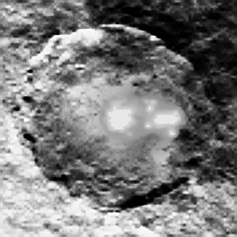 This up close, cropped view of Ceres pair of bright spots has been processed to unveil further details.  The  image was taken by NASA's Dawn spacecraft on May 4, 2015, from a distance of 8,400 miles (13,600 kilometers), in its RC3 mapping orbit. The bright spots are within a crater in the northern hemisphere and are revealed to be composed of many smaller spots.   Credit: NASA/JPL-Caltech/UCLA/MPS/DLR/IDA.  Additional Processing: Marco Di Lorenzo/Ken Kremer