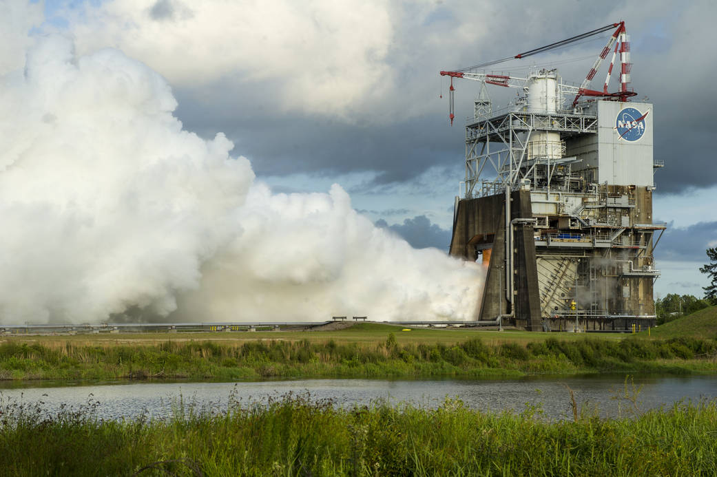 A billowing plume of steam signals a successful 450-second test of the RS-25 rocket engine for NASA's Space Launch System (SLS) on May 28 at NASA's Stennis Space Center near Bay St. Louis, Mississippi. Photo Credit: NASA