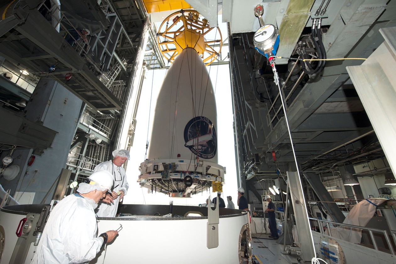 The Air Force's AFSPC-5 payload, encapsulated inside a 5-meter diameter payload fairing, is mated to an Atlas V booster inside the Vertical Integration Facility or VIF at Cape Canaveral Air Force Station's Space Launch Complex-41. Photo Credit: ULA