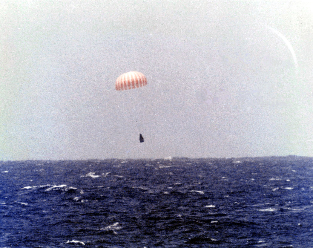 Faith 7 descends to a splashdown on 16 May 1963, after Project Mercury's longest mission of 34 hours. Photo Credit: NASA