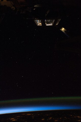 The movement of the Leonardo PMM will allow an unobstructed view of the underside of the U.S. Orbital Segment (USOS) from the multi-windowed cupola, seen here ablaze with lights at orbital sunrise on 23 May. Photo Credit: NASA