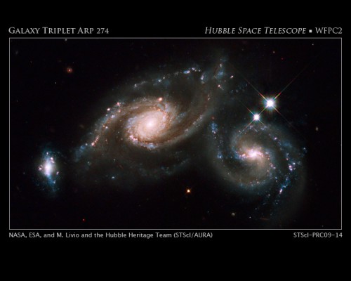 A Hubble image of Arp 274, also known as NGC 5679, a system of three galaxies that appear to be partially overlapping. Image Credit: NASA, ESA, M. Livio and the Hubble Heritage Team (STScI/AURA)