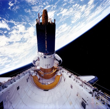 Under Thomas' direction, the seventh Tracking and Data Relay Satellite (TDRS-G) departs Discovery's payload bay during STS-70. Photo Credit: NASA