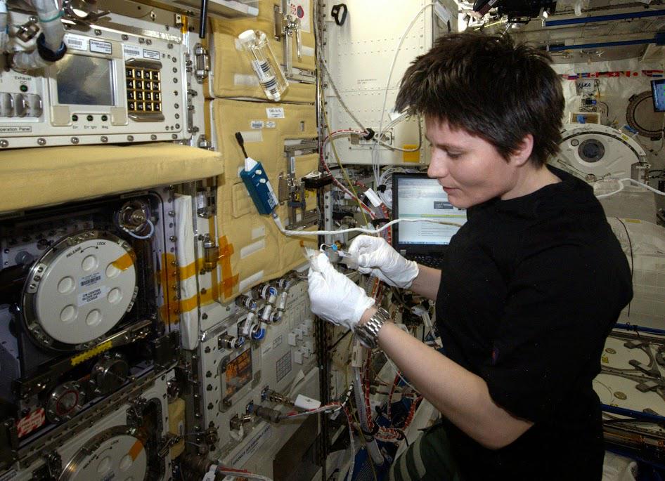 Expedition 43 crew member and European Space Agency (ESA) astronaut Samantha Cristoforetti working with the C.Elegans muscle experiment last week on the ISS. Photo Credit: Twitter via @AstroSamantha